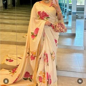 Manto.  I’m looking this saree to buy……….Elegant Floral Cream Saree with Pink
